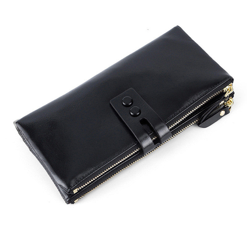 Vintage oil wax leather wallet in black, featuring a sleek two-fold design and secure money clip for durability and elegance.